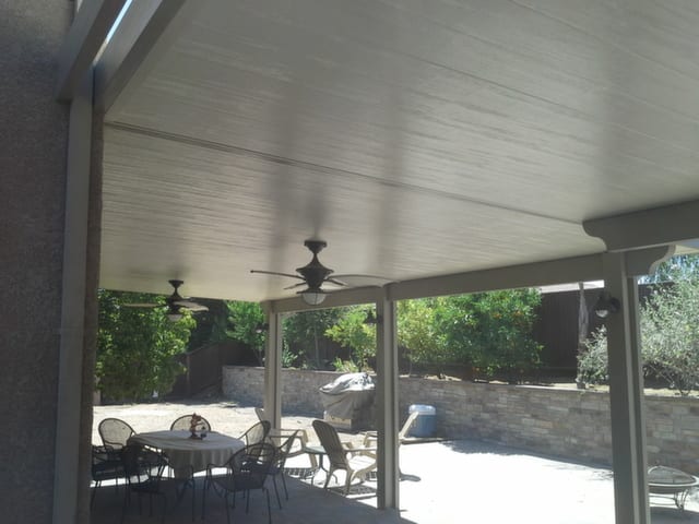 A patio with a dining area