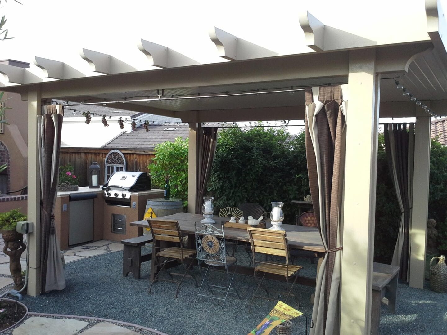 A patio with a grill area